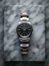 Classic Silver Stainless Steel Men's Watch with Textured Black Dial – Executive Wristwatch